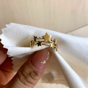 Detailed close-up of a French vintage gold star ring with cubic zirconia stones