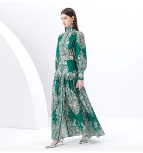 Detail of vintage high collar and puff sleeves on long floral print dress in dark green