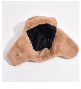 Detail showing plush faux fur texture and black quilted lining of winter trapper hat