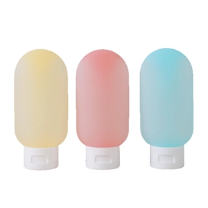 Three-piece 60ml silicone travel bottle set in pastel colors with white flip-top caps