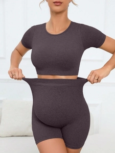 Close-up of charcoal ribbed knit yoga set showing high elasticity for pregnancy comfort