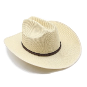 Close-up of woven straw cowboy hat with a dark brown leather belt and wide curved brim