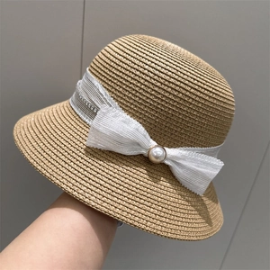Hepburn style straw sun hat with white lace bow and large pearl accent decoration