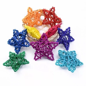 Set of 8 colorful 6cm rattan stars in a small basket for DIY crafts and decorations