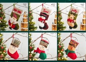 Detailed view of large plush Christmas stockings featuring Santa, Snowman and Reindeer designs