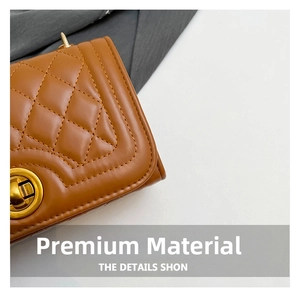 Close-up of brown quilted leather texture and a vintage golden metal rotating lock