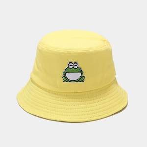 Detailed view of yellow canvas bucket hat with cute cartoon frog embroidery and stitching