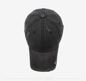 Close-up of distressed cotton baseball cap with Boston embroidery and vintage torn details