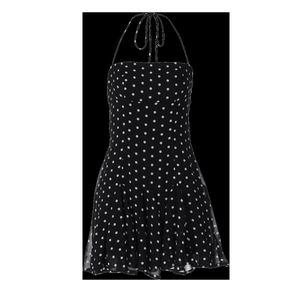 Detail of black polka dot halter dress featuring a lightweight A-line skirt and neck strap