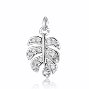 Detailed view of silver palm leaf pendant with sparkling cubic zirconia stones