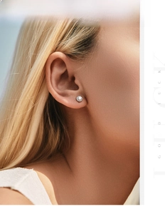 Close-up of elegant S925 silver halo stud earrings with brilliant round moissanite stones