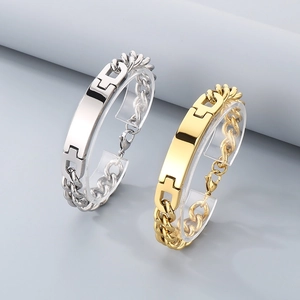 Detailed view of gold and silver minimalist cuban link bracelets with curved metal plates