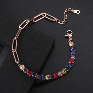 Detail of rose gold paperclip tennis bracelet with multi-color zircon stones