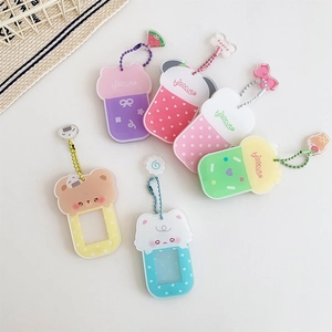 Close-up of colorful acrylic drink and bear charms with beaded chains for photos