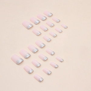 Sparkly nude pink French ombre press-on nails with silver glitter gradient and square shape