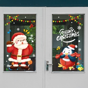 Christmas Santa and Penguin window stickers with snowflakes on double glass doors