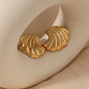 Elegant gold conch shell earrings in stainless steel with a polished textured finish