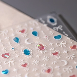 3D embossed nail art stickers with pink and blue butterfly and heart designs