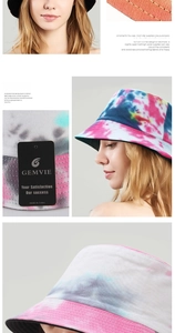 Detail showing the tie-dye cotton fabric, precise stitching, and brand tag of the sun hat