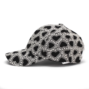 Close-up of heart embroidery pattern on high-quality black canvas baseball cap