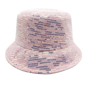 Detailed close-up of shiny pink and silver sequins on a stylish reversible bucket hat