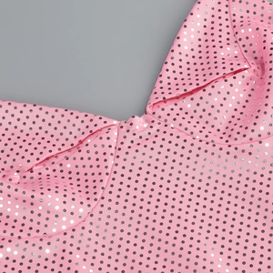 Close-up of pink sequined slit dress featuring silver dot patterns and fine stitching