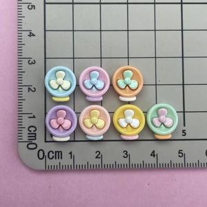 Macro shot of 1.5x2cm colorful resin mini fan charms for nail art and DIY jewelry