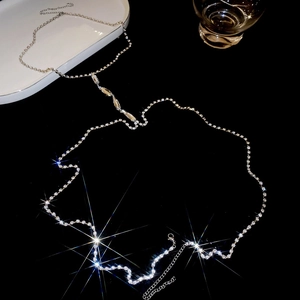 Close-up of sparkling rhinestone body chain with Y-shaped drop and lobster clasp