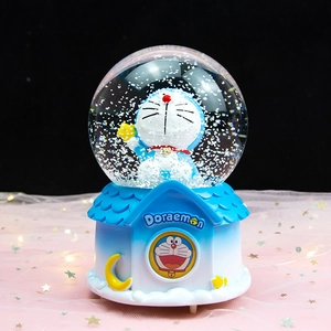 Doraemon musical snow globe with house base and glowing festive star background