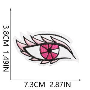 Close-up of pink eye embroidery patch with size dimensions 7.3cm x 3.8cm