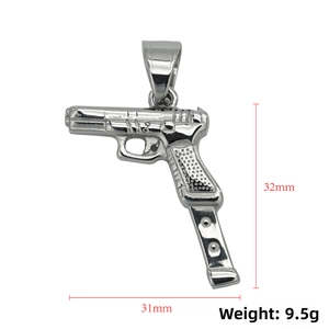 Detailed gun pendant charm in polished steel showing 31mm width and 32mm height