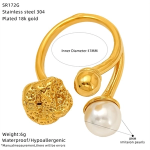 Detail of 18k gold plated stainless steel open ring with 8mm pearl and lava texture