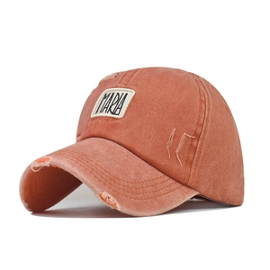 Detailed view of the vintage washed brick red cotton baseball cap with MARIA embroidery