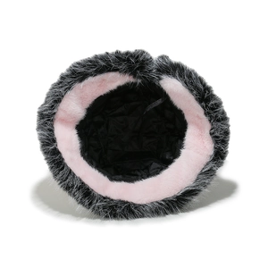 Detail of plush bucket hat featuring black-white faux fur and pink inner lining trim