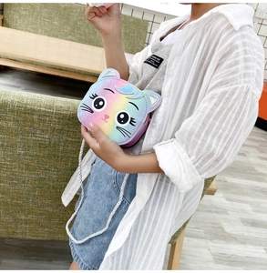 Detail of cute cat shaped rainbow glitter kids shoulder bag with braided strap