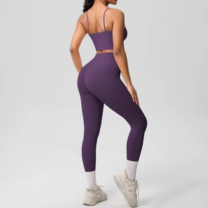 Close-up of deep purple yoga set showing fine brushed texture and cross back detail