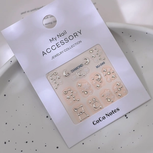 Embossed constellation nail stickers with silver moon, stars, and sparkling K9 crystals