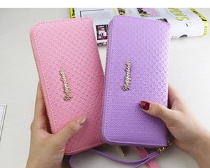 Pink and purple long zip wallets with cross-grain texture and wrist straps detail