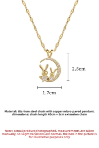 Detail of titanium steel crescent moon and twin rabbit necklace with size measurements