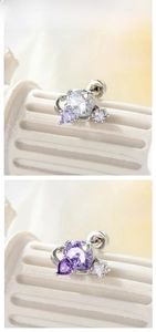 Détails macro des boucles d'oreilles cœur et étoile avec fermoir à vis sécurisé