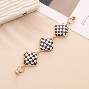 Checkerboard pattern zinc alloy bracelet with gold twist frames and magnetic clasp