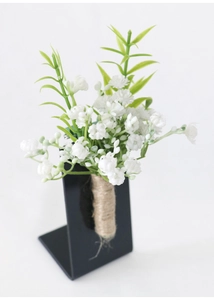 Close-up of white gypsophila boutonniere with green leaves and rustic hemp rope stem