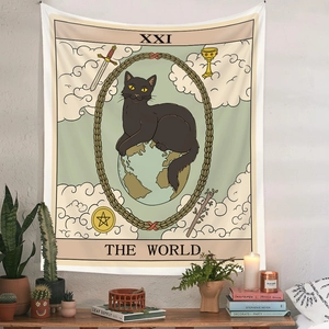 Detailed view of The World tarot black cat tapestry hanging on a white wall above home decor