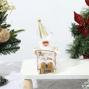 Detail of Santa Claus figurine on wooden sled with white and gold glittery Christmas theme