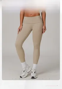Detail view of high waist khaki yoga leggings with model info 176cm 62kg wearing size S