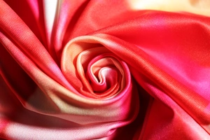 Macro view of colorful gradient textile fabric with fine fiber texture for dresses
