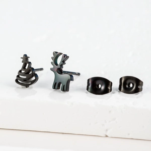 Detail of iridescent black stainless steel Christmas tree and reindeer stud earrings
