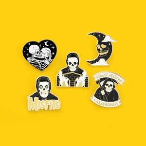Gothic skull pins set featuring heart and moon designs in black and gold enamel