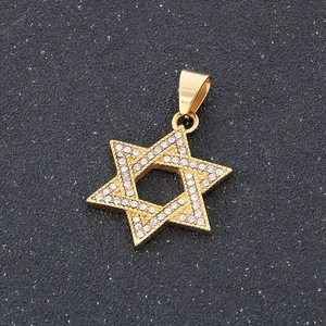 Macro view of gold plated Star of David pendant with shimmering clear rhinestones