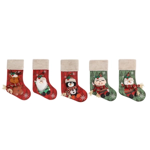 Set of five red and green felt Christmas stockings with reindeer and Santa designs
